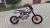 Pitbike MiniRocket DT125 17/14 světlo, el startér, řazení se spojkou, sedlo 86cm oranžový